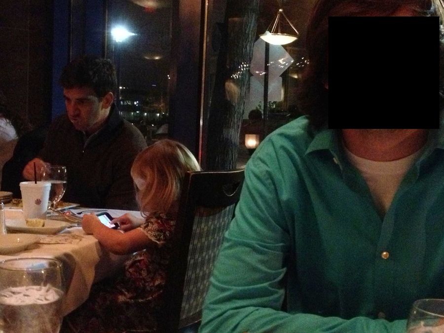 Eli Manning At A Restaurant, Looking At Something