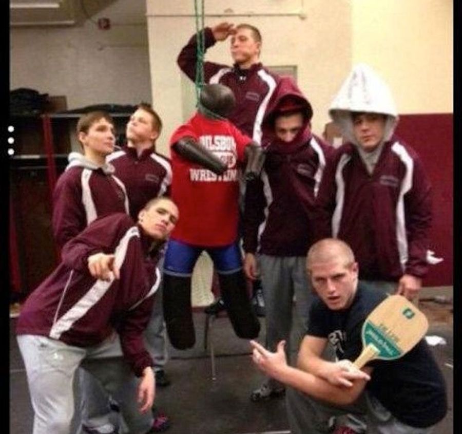 High School Wrestlers Wearing Pointed Hoods Lynch Rival In Effigy