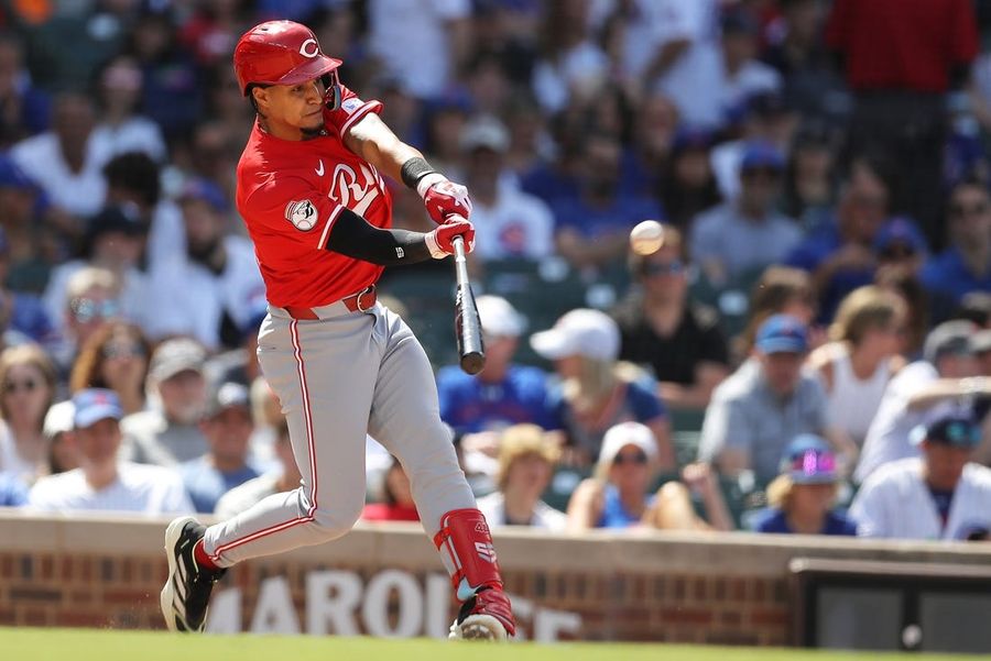 Reds rally, then hold off Cubs to open series