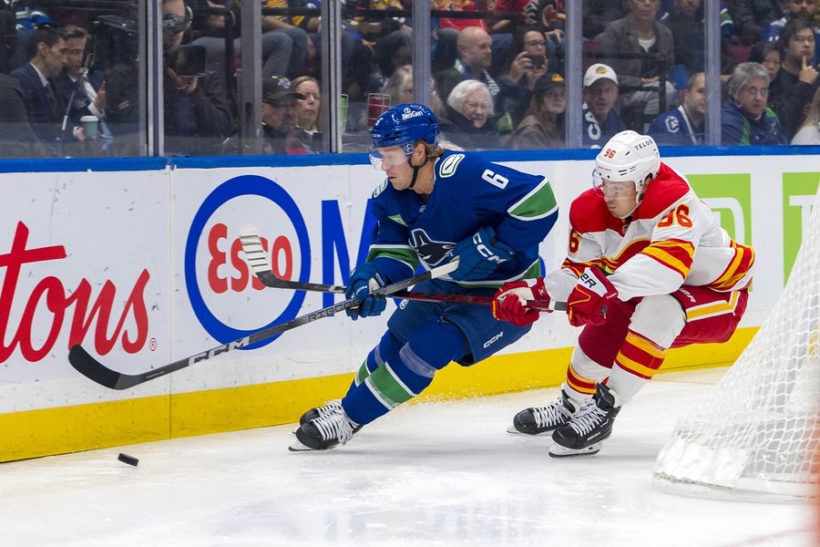 Flames rally from down 3 to top Canucks in OT