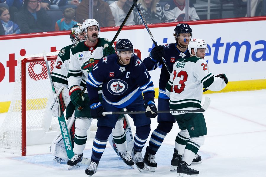 NHL roundup: Jets keep rolling with OT win vs. Wild