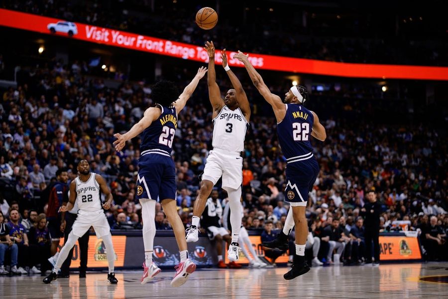 Spurs maintain lead to beat short-handed Nuggets