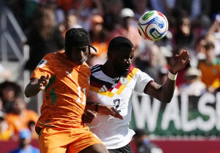 Late strike gets Germany past Ivory Coast, into knockout round