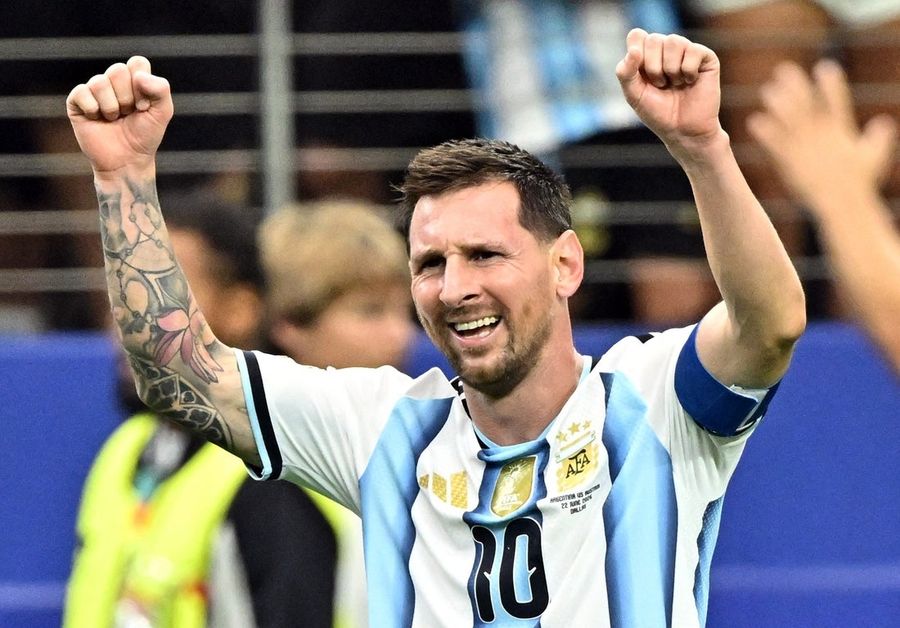 Argentina shut down Austria 2-0 as Lionel Messi makes history