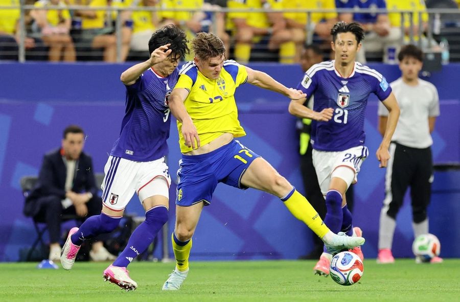 Japan, thanks to late saves, draw with Sweden, finish second in Group F