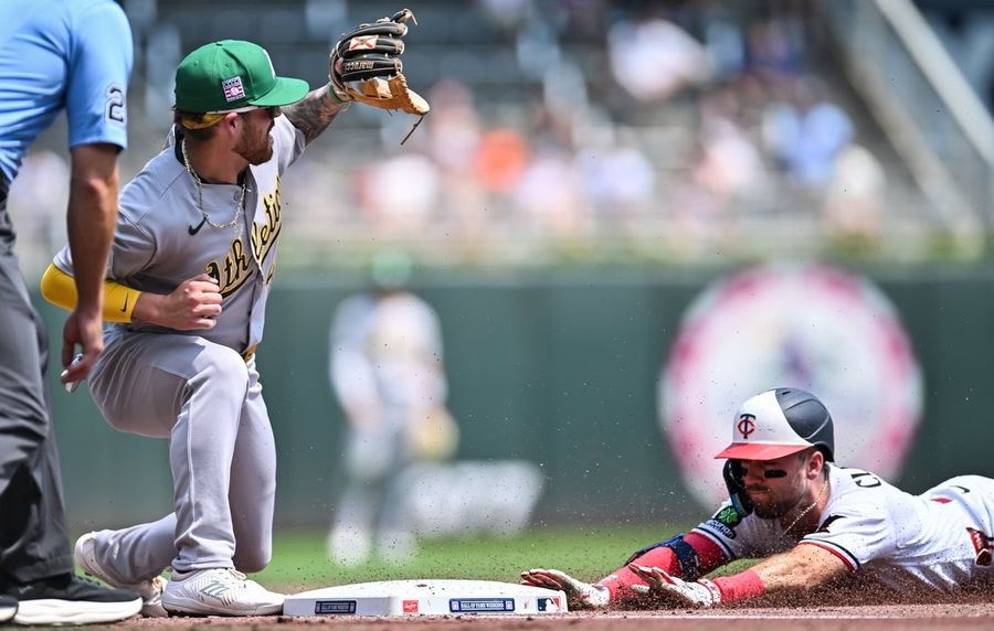 Twins roll up big lead, hold on to beat Athletics