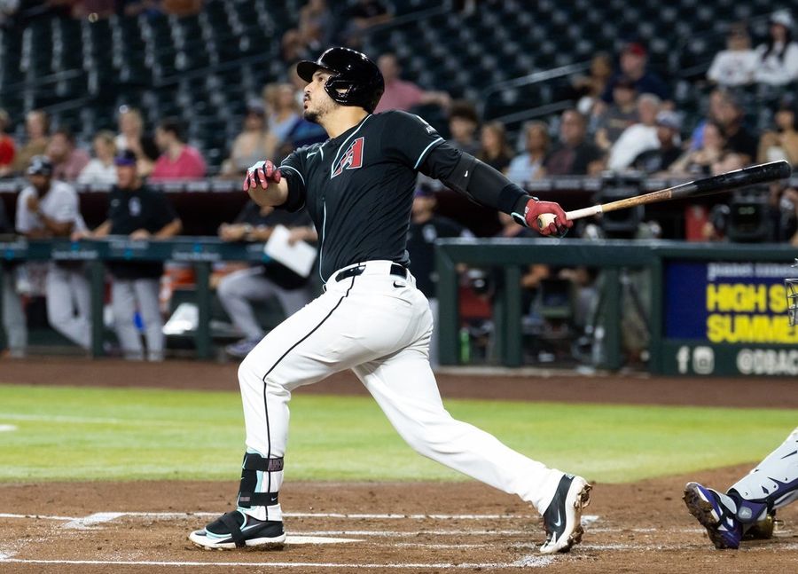 Behind Nolan Arenado's grand slam, D-backs demolish Rockies
