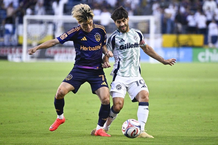 Galaxy jump ahead early, hold off Revolution surge