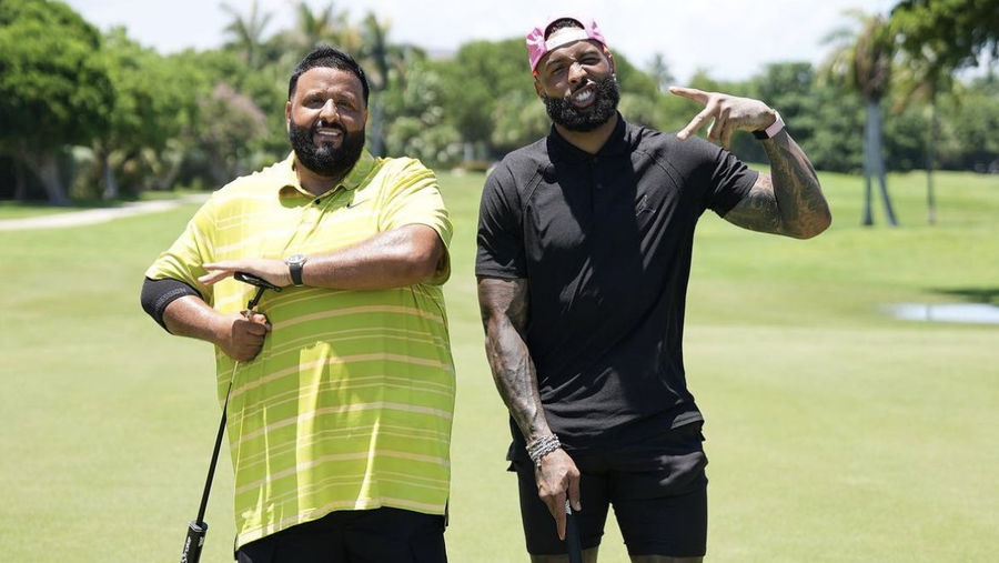 OBJ and DJ Khaled walk onto a golf course….