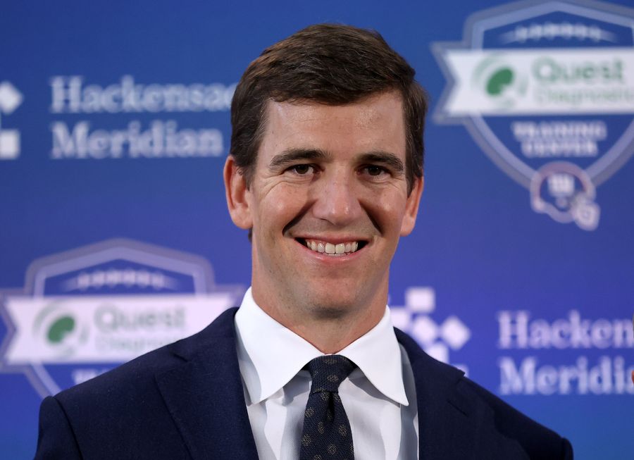 Eli Manning getting his flowers from Giants, along with a new job