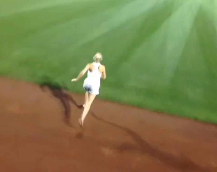 Girl Jumps Onto The Field During College World Series Game