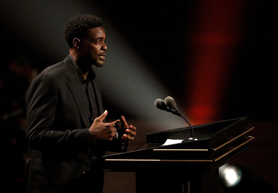 Between Chris Webber and Michigan AD Warde Manuel — someone is lying