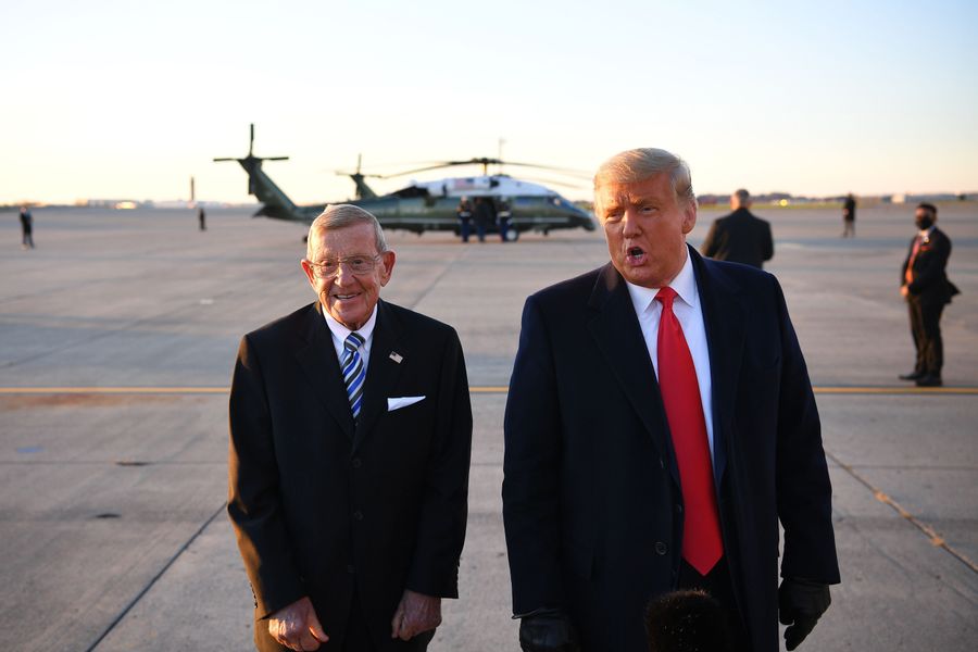 Lou Holtz, who likened football to storming Normandy, has COVID-19