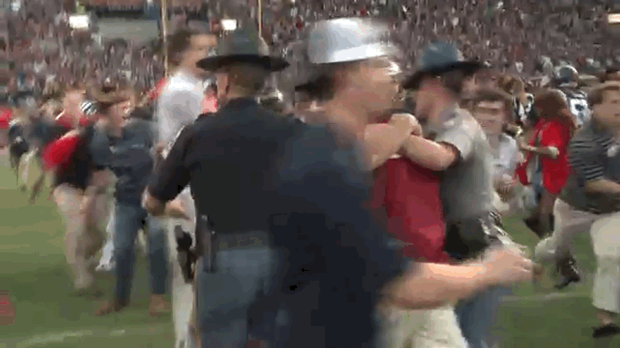 Police Officer Levels Kid Running At Nick Saban After Ole Miss Win