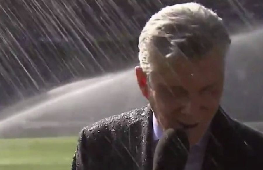 Michael Buffer Announces Soccer Lineup While Being Soaked By A Sprinkler 