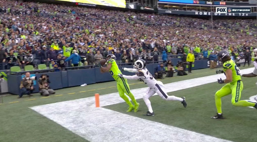 Russell Wilson Throws Up Prayer, Tyler Lockett Answers
