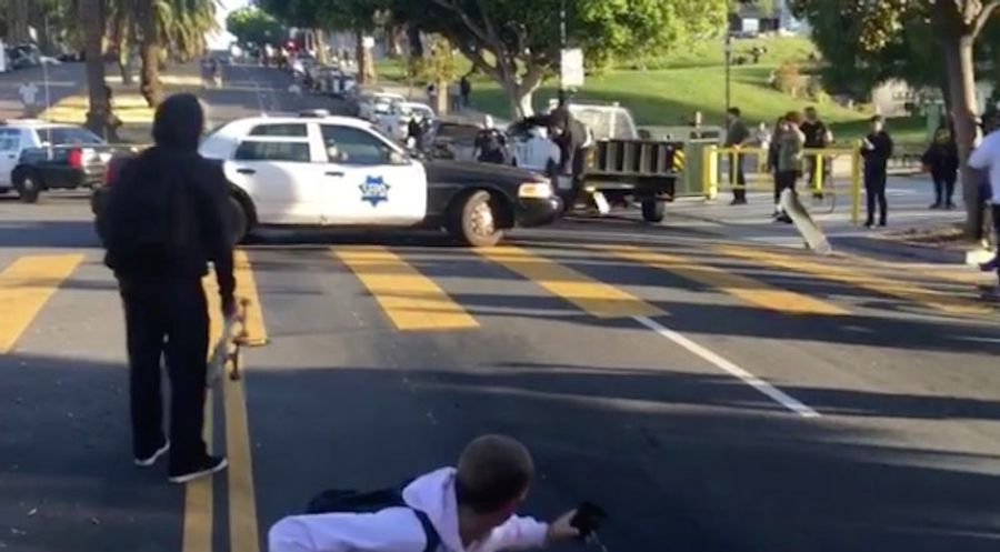 Policeman Guides Downhill Skateboarder Right Into The Hood Of A Cop Car