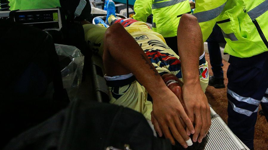 Giovani dos Santos Carted Off After Gnarly Studs-Up Tackle Takes Out A Chunk Of His Leg