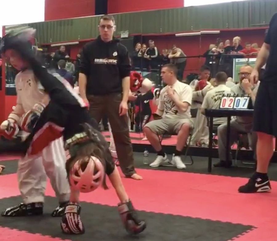 Kickboxing Child Cartwheel-Kicks Opponent