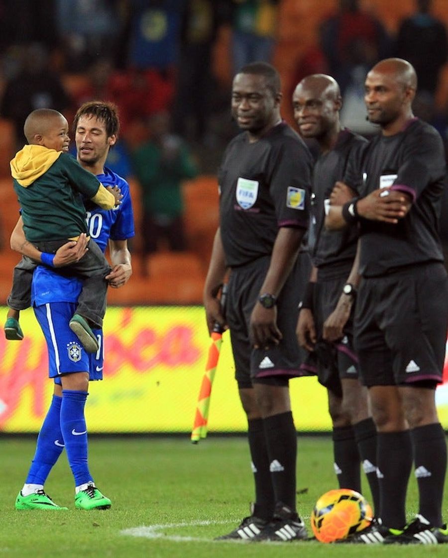 Cutest Kid Ever Invades Soccer Pitch, Gets Carried Around By Players