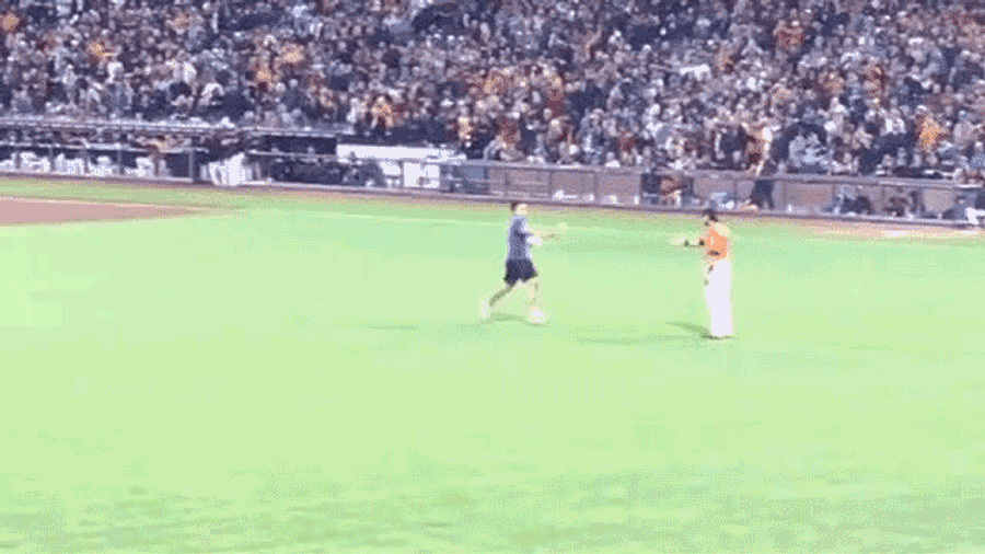 Idiot On The Field Gets Bodyslammed By Angel Pagan [Update]