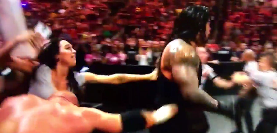 <i>Raw</i> Attendee Loses Her Damn Mind Watching Roman Reigns Beat Down Triple H