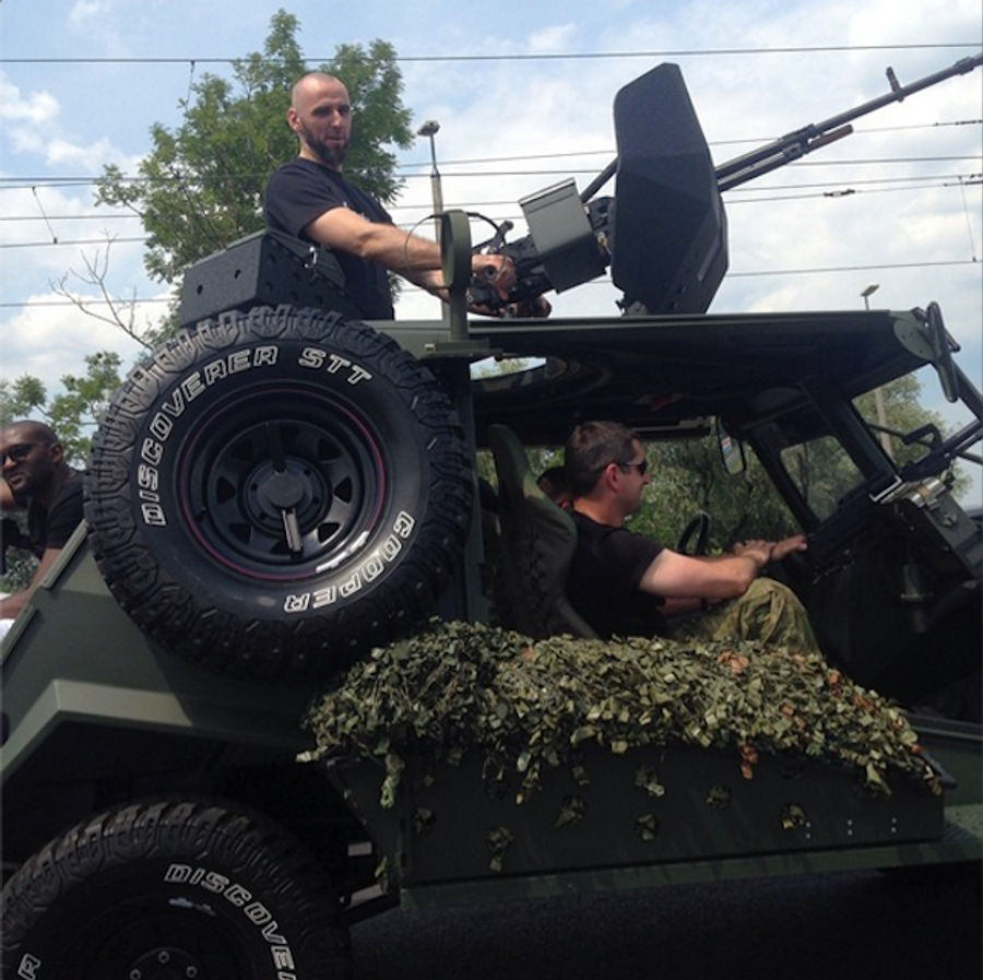Marcin Gortat Rides Humvee With Giant Gun Into His Basketball Camp