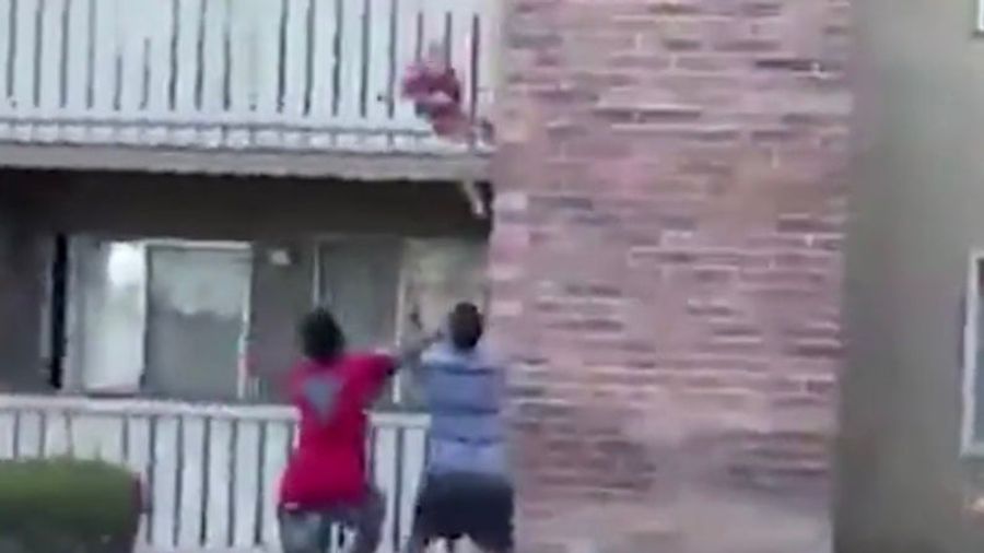 Former Football Receiver Catches Child Dropped From Burning Building