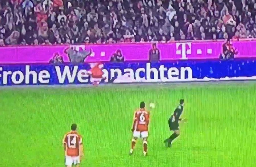 Bayern Munich Player Passes Ball To Advertisement