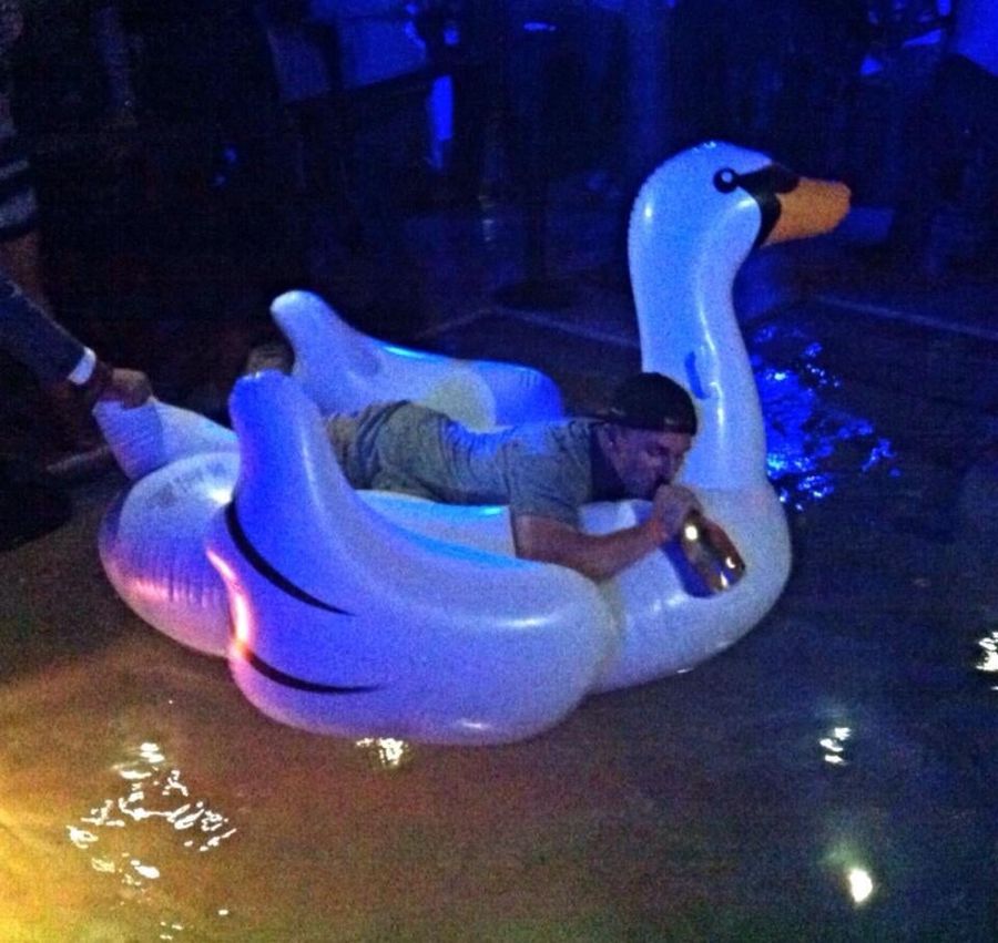 Johnny Manziel Drinking On An Inflatable Swan