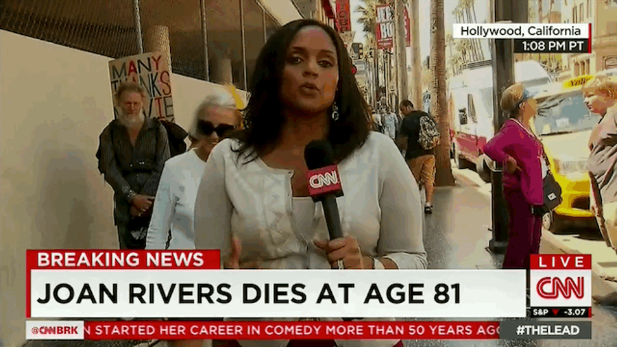 Man Does Money Sign In Background Of CNN's Joan Rivers Death Report