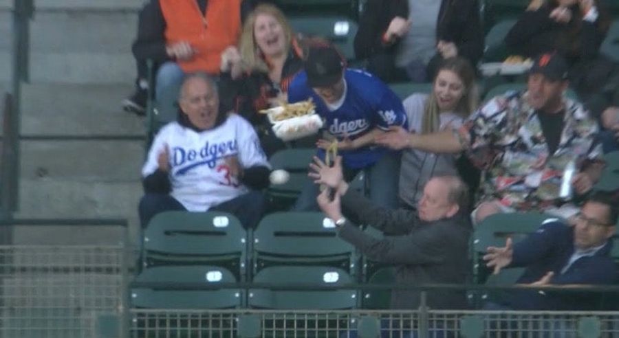 Dodgers Fan Keeps Trying To Catch Foul Balls, Keeps Throwing Food All Over The Damn Place