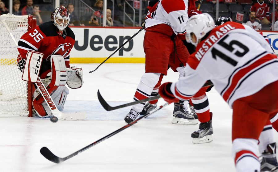 Devils Beat Hurricanes In Hockey Game