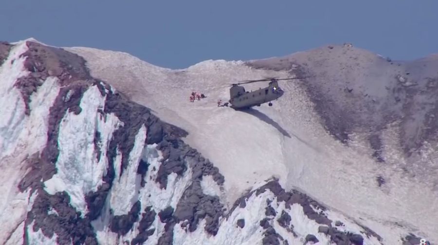 Daring Mountain Rescue Features Helicopter Parking Its Butt Right On The Snow