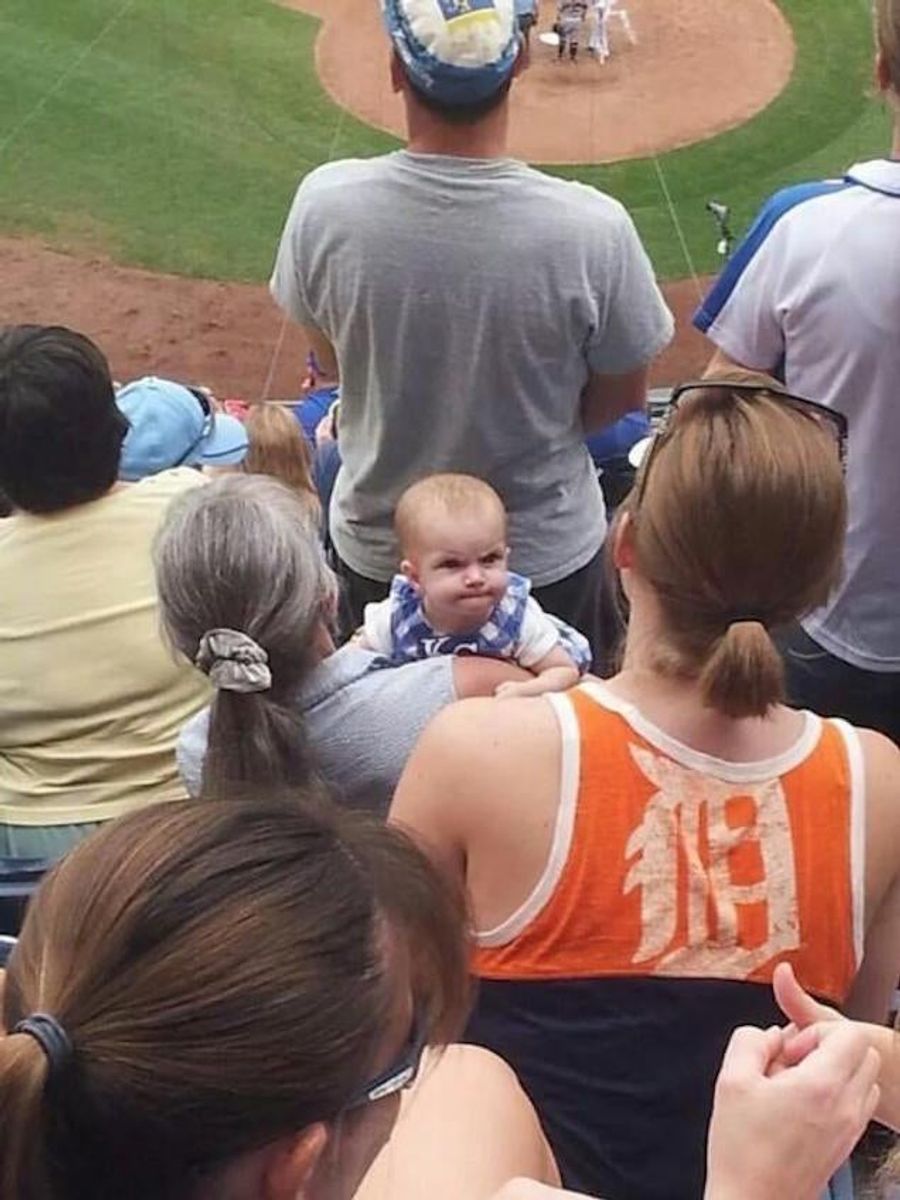 Angry Baby Royals Fan Mean-Mugs Tigers Fan, Gives Her The Finger