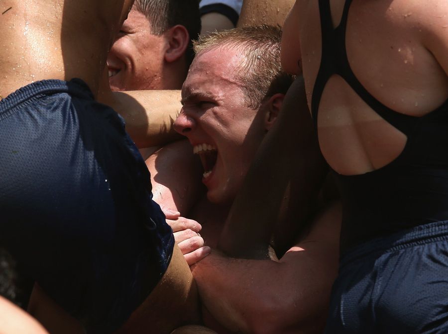 Gallery: Greasy Naval Cadets Try To Climb A Lard-Covered Monument