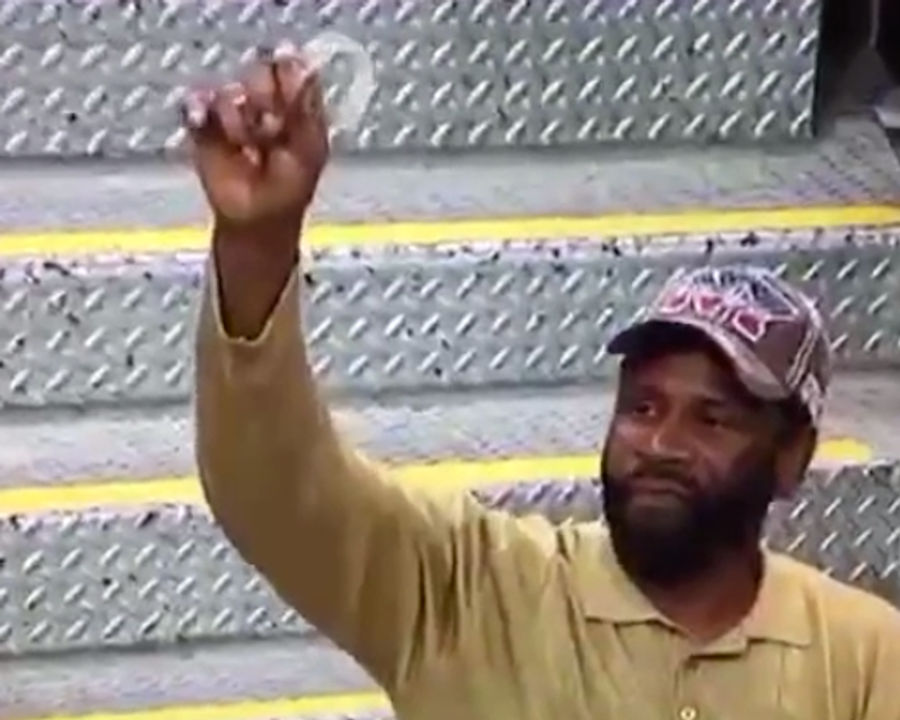 Why Is This Man Triumphantly Holding A Used Mouthguard In The Air?