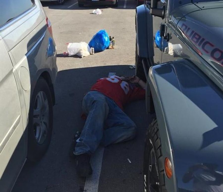 Sad Chiefs Fan Finds A Nice Spot To Lie Down In The Parking Lot