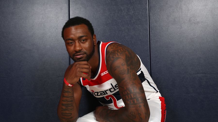 John Wall was way too busy playing spades to pay attention during an ESPN interview