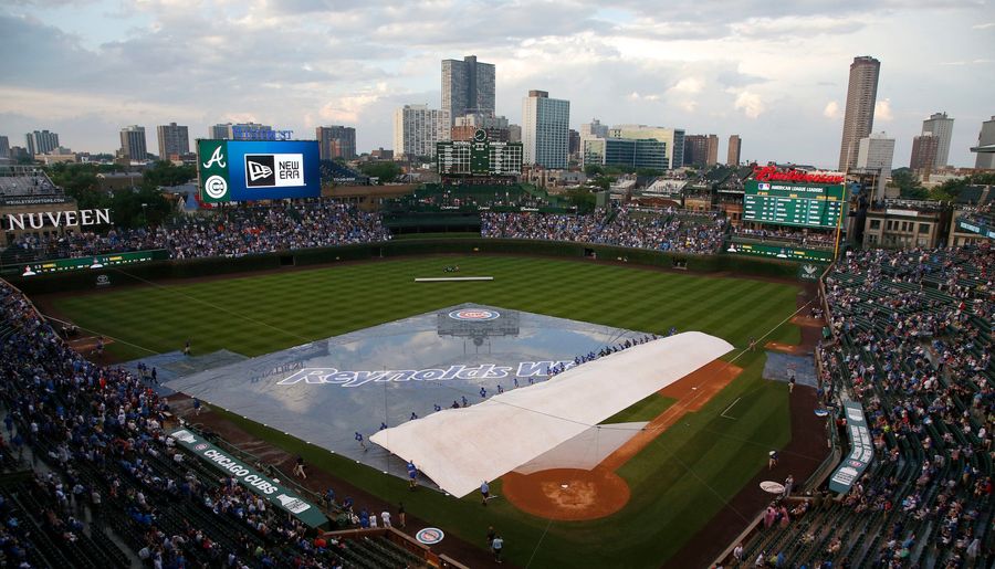 Cubs Fan Carted Off Wrigley Field After Falling Onto Warning Track During Rain Delay
